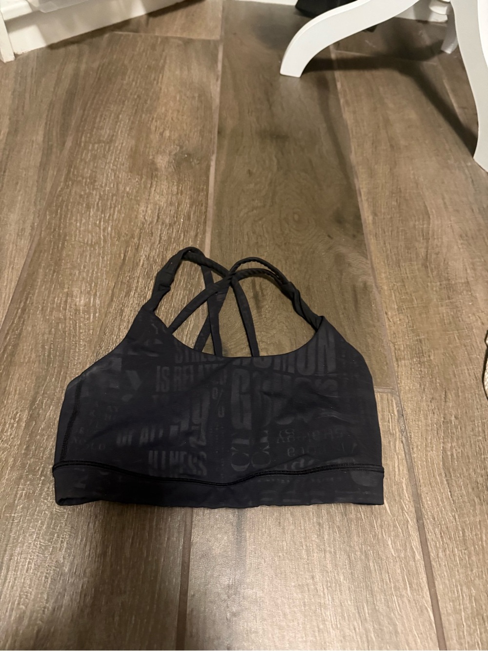Lululemon-Black sports bra with cross-cross, light pattern-size S